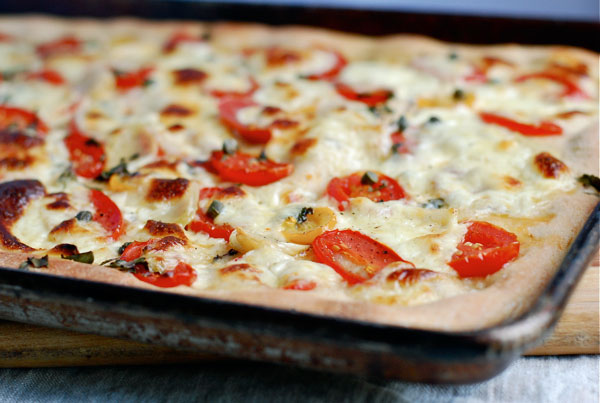Simple summer pizza with tomatoes, basil and fresh mozzarella, via brooklynsupper.net; © Brooklyn Supper, all rights reserved Simple summer pizza with tomatoes, basil and fresh mozzarella, via brooklynsupper.net; © Brooklyn Supper, all rights reserved