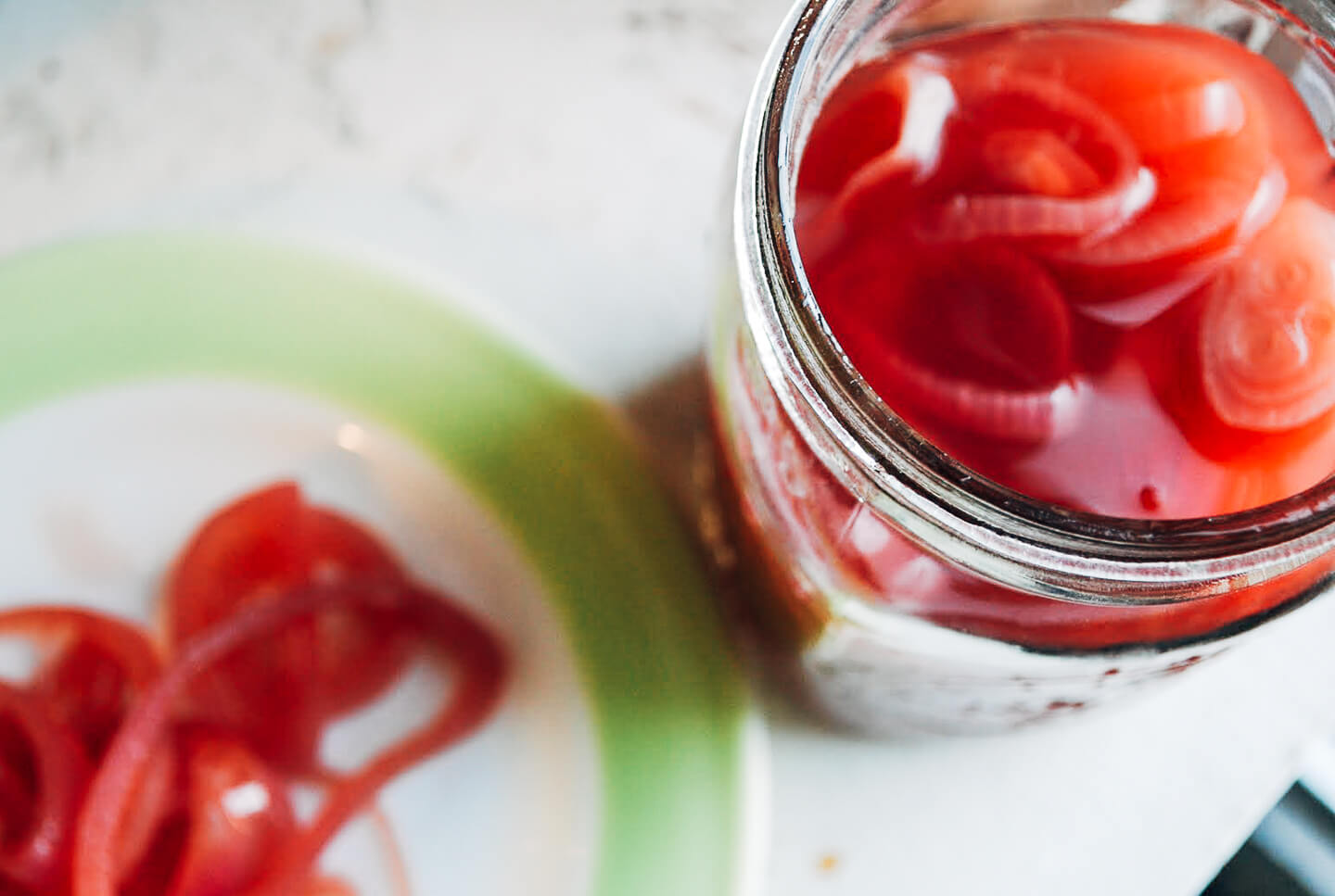 A recipe for punchy and vibrant quick-pickled red onions that lend pop and crunch to everything from sandwiches to salads. 