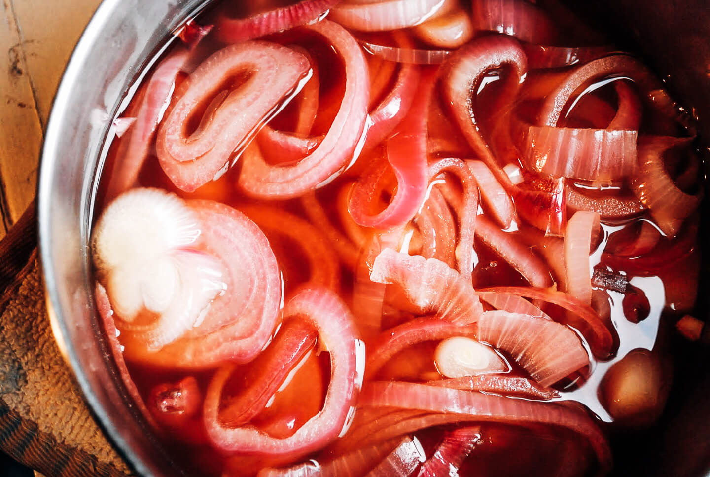 A recipe for punchy and vibrant quick-pickled red onions that lend pop and crunch to everything from sandwiches to salads. 