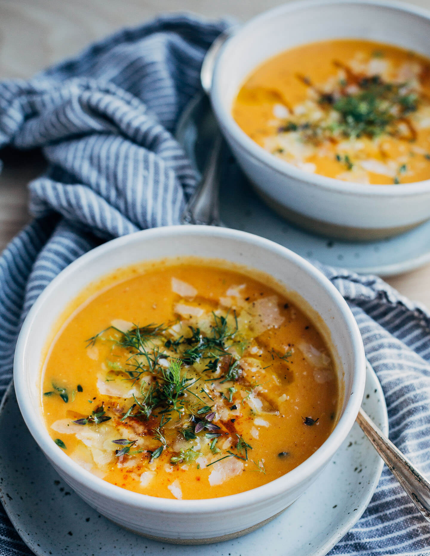 A silky carrot and fennel soup with a hint of fresh squeezed orange juice that's topped with shaved Parmesan and fresh herbs. It's warming and delicious and just the thing for these snowy winter days.