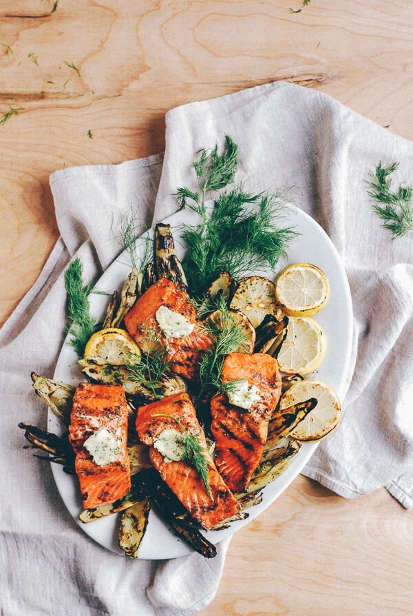 A platter of grilled salmon, fennel, and corn.