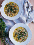 Two bowls of soup on a table