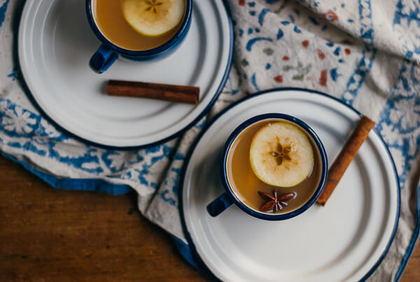 Two mugs of apple cider.
