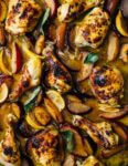 A simple sheet pan chicken and plums recipe featuring crispy saffron- and garlic-infused chicken topped with a sweet and savory plum pan sauce.