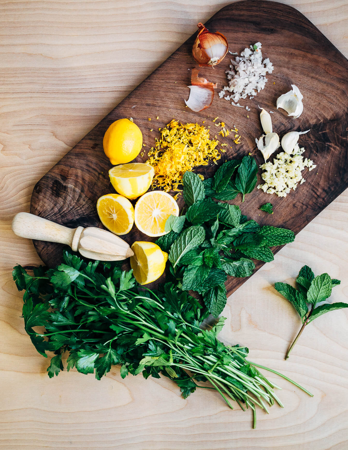 Broiled salmon fillets with a vibrant Meyer lemon and mint chimichurri makes for a simple, yet elevated mid-winter meal that's perfect for a Valentine's dinner at home. 