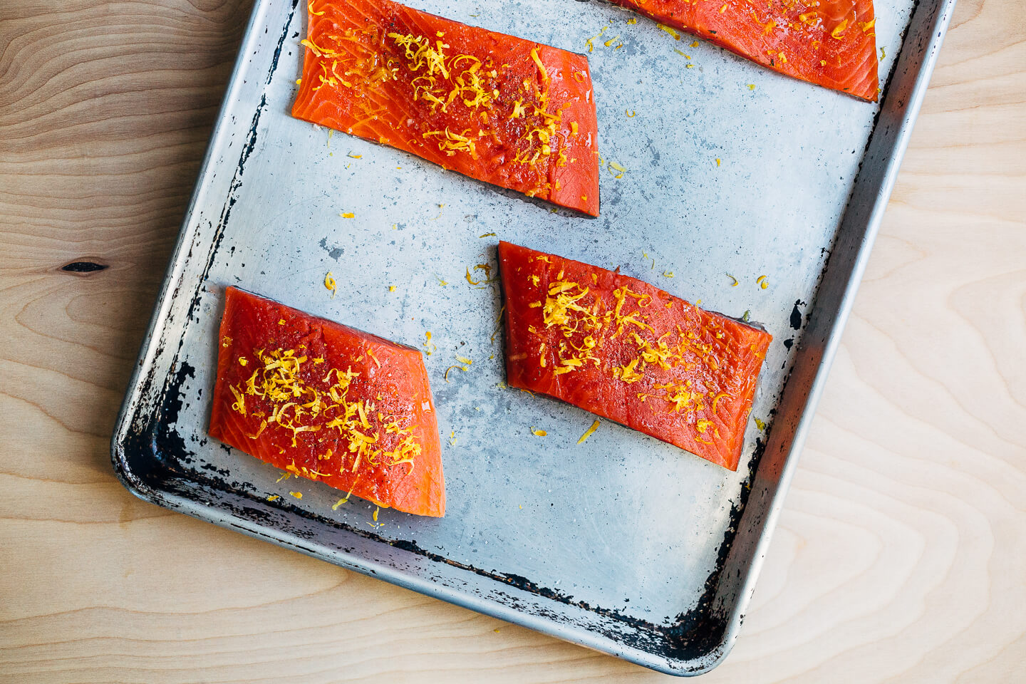Broiled salmon fillets with a vibrant Meyer lemon and mint chimichurri makes for a simple, yet elevated mid-winter meal that's perfect for a Valentine's dinner at home. 
