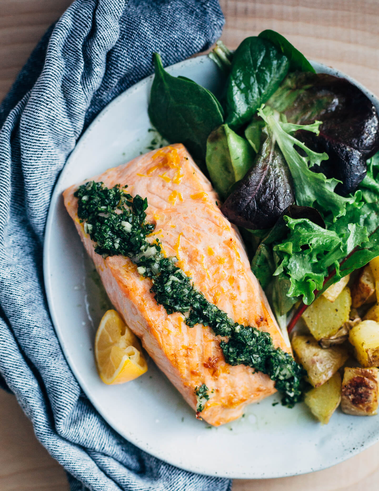 Broiled salmon fillets with a vibrant Meyer lemon and mint chimichurri makes for a simple, yet elevated mid-winter meal that's perfect for a Valentine's dinner at home. 