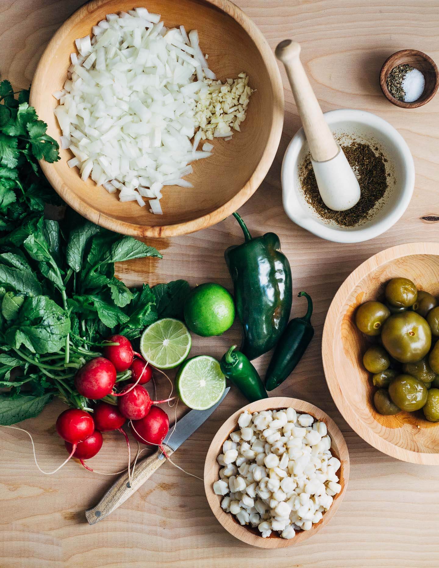 A fortifying mix of rich chicken broth, tender shredded chicken, chewy corn hominy, and tart tomatillos make this chicken pozole verde the ideal dish to see you through the end of winter (and cold season).