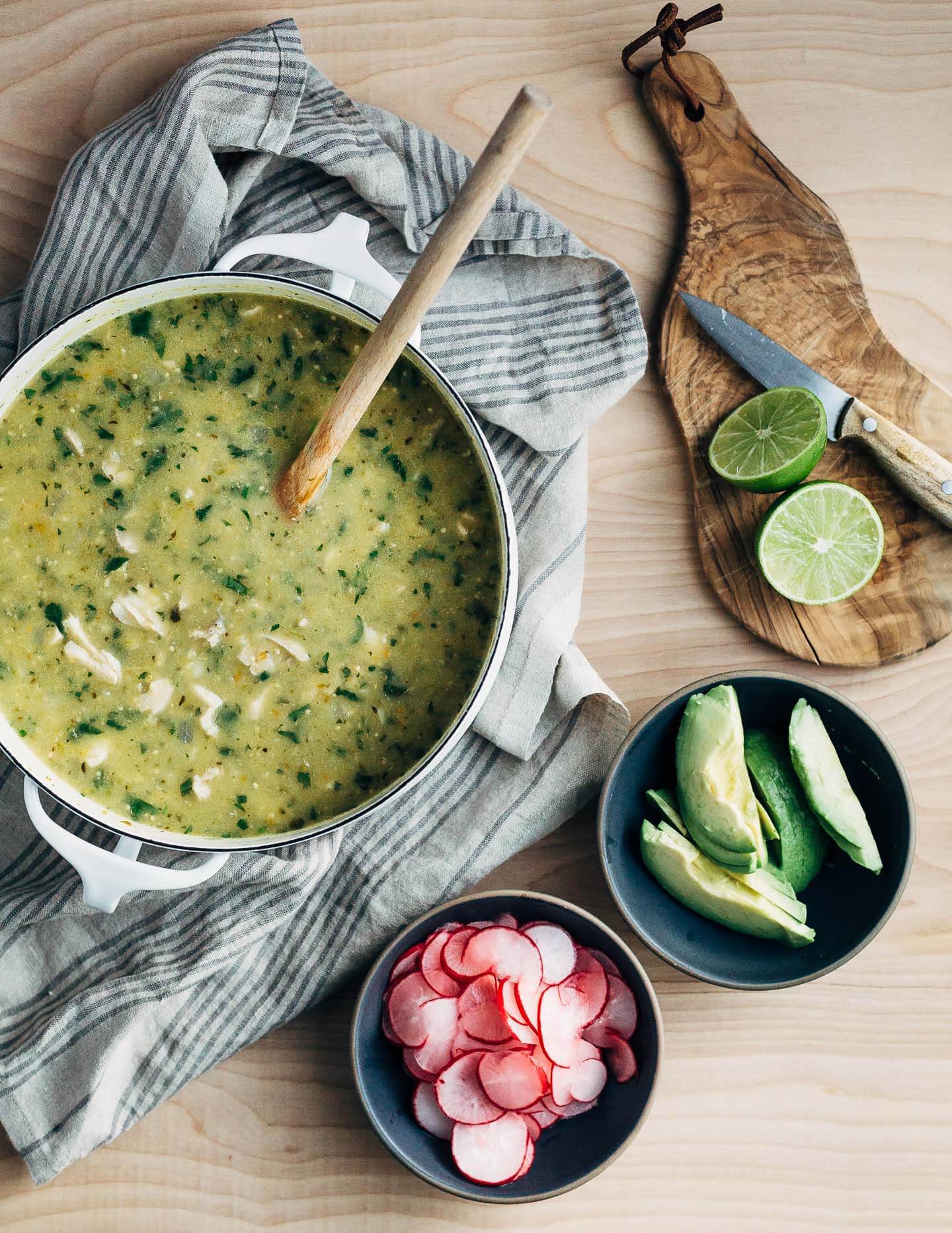 A fortifying mix of rich chicken broth, tender shredded chicken, chewy corn hominy, and tart tomatillos make this chicken pozole verde the ideal dish to see you through the end of winter (and cold season).