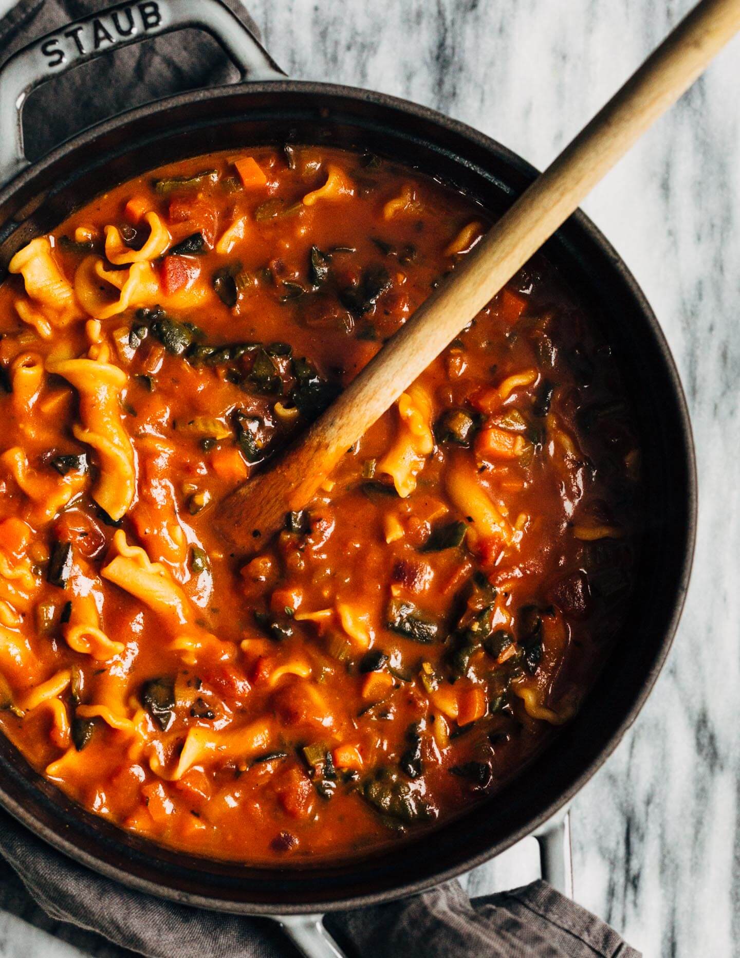 A meal-worthy vegan vegetable pasta soup with a little bit of everything: delicious vegetable broth, fire-roasted tomatoes, kale, carrots, thyme, and toothsome pasta.