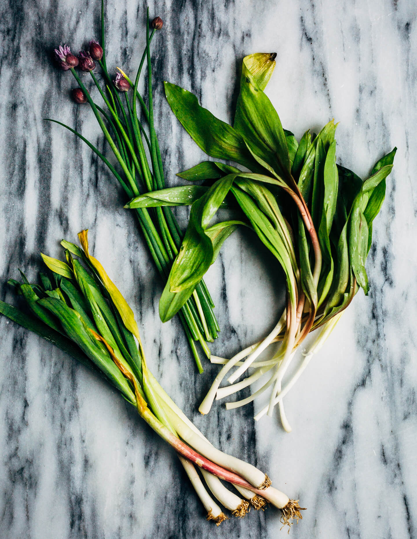 Ideal for Mother's Day brunch or spring gatherings, this sheet pan spinach quiche, made with ramps, green garlic, and chives, is a delicious way to feed a crowd.