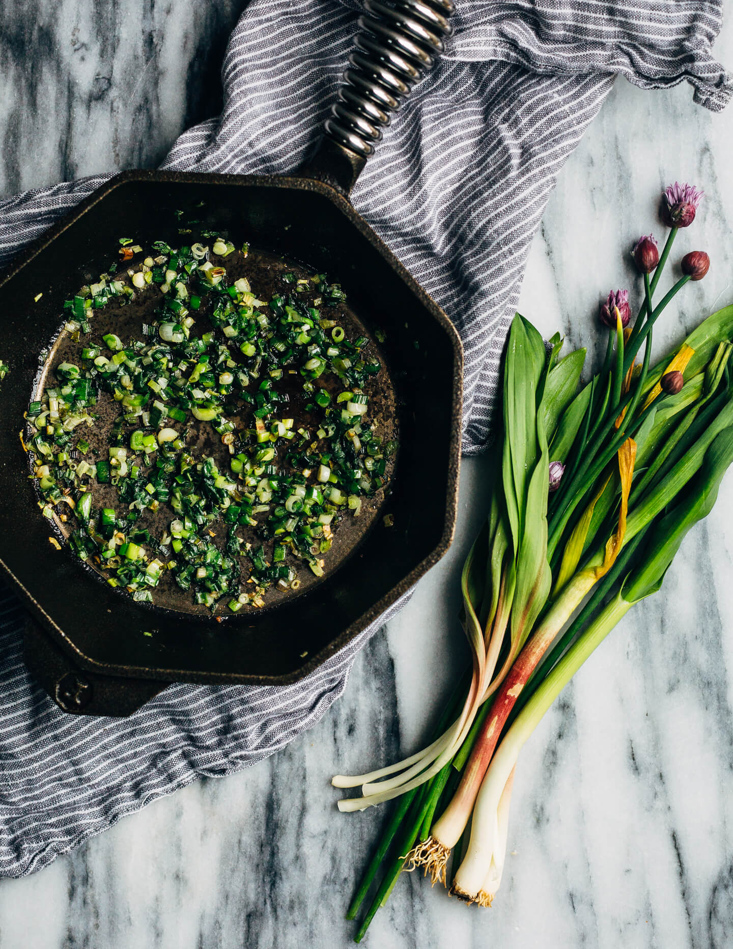 Ideal for Mother's Day brunch or spring gatherings, this sheet pan spinach quiche, made with ramps, green garlic, and chives, is a delicious way to feed a crowd.