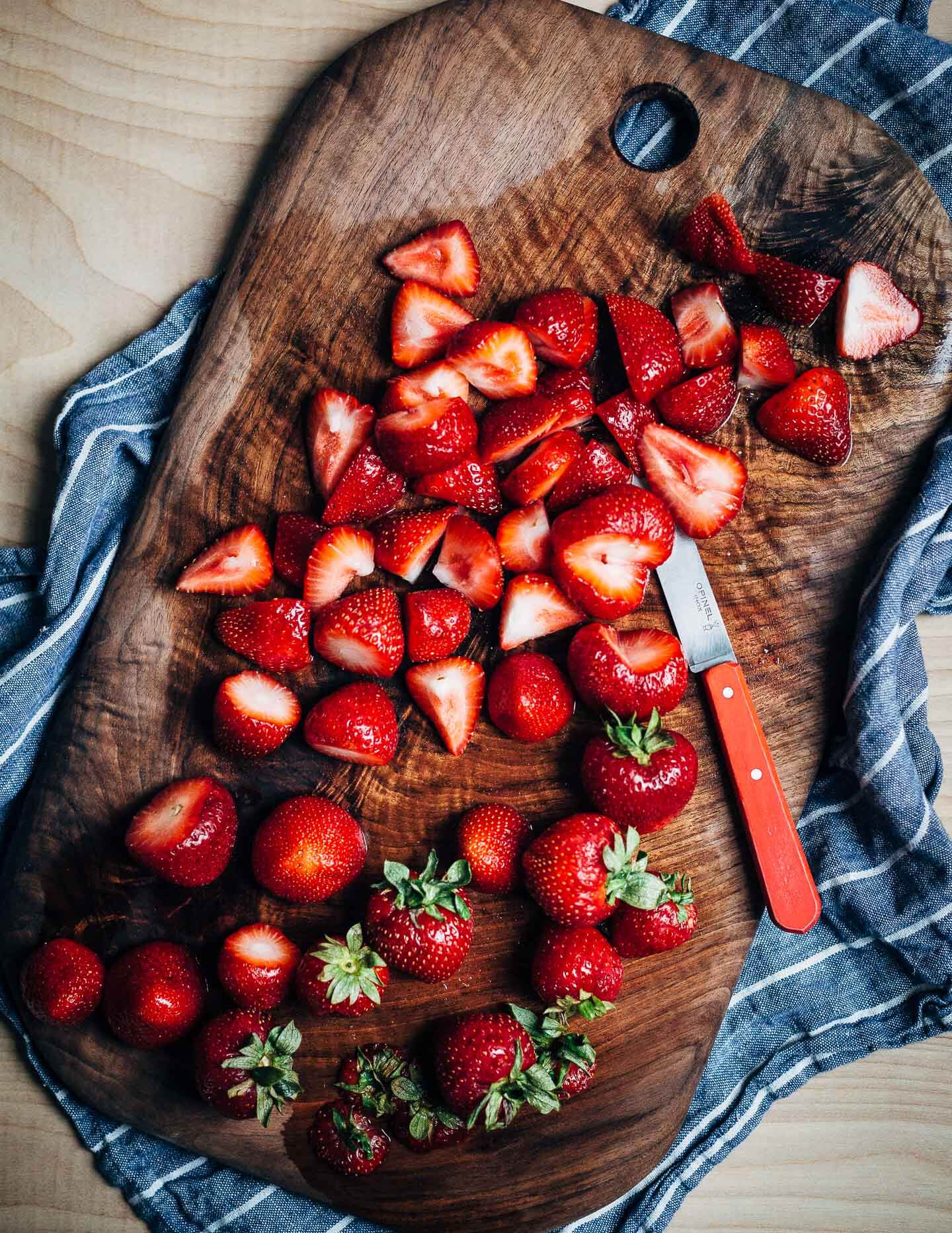 Ripe strawberries in red wine is the kind of effortless summer dessert that we all need more of. With hints of lemon and fresh thyme, the red wine reduction melds beautifully with ripe strawberries and is perfect spooned over vanilla ice cream. 