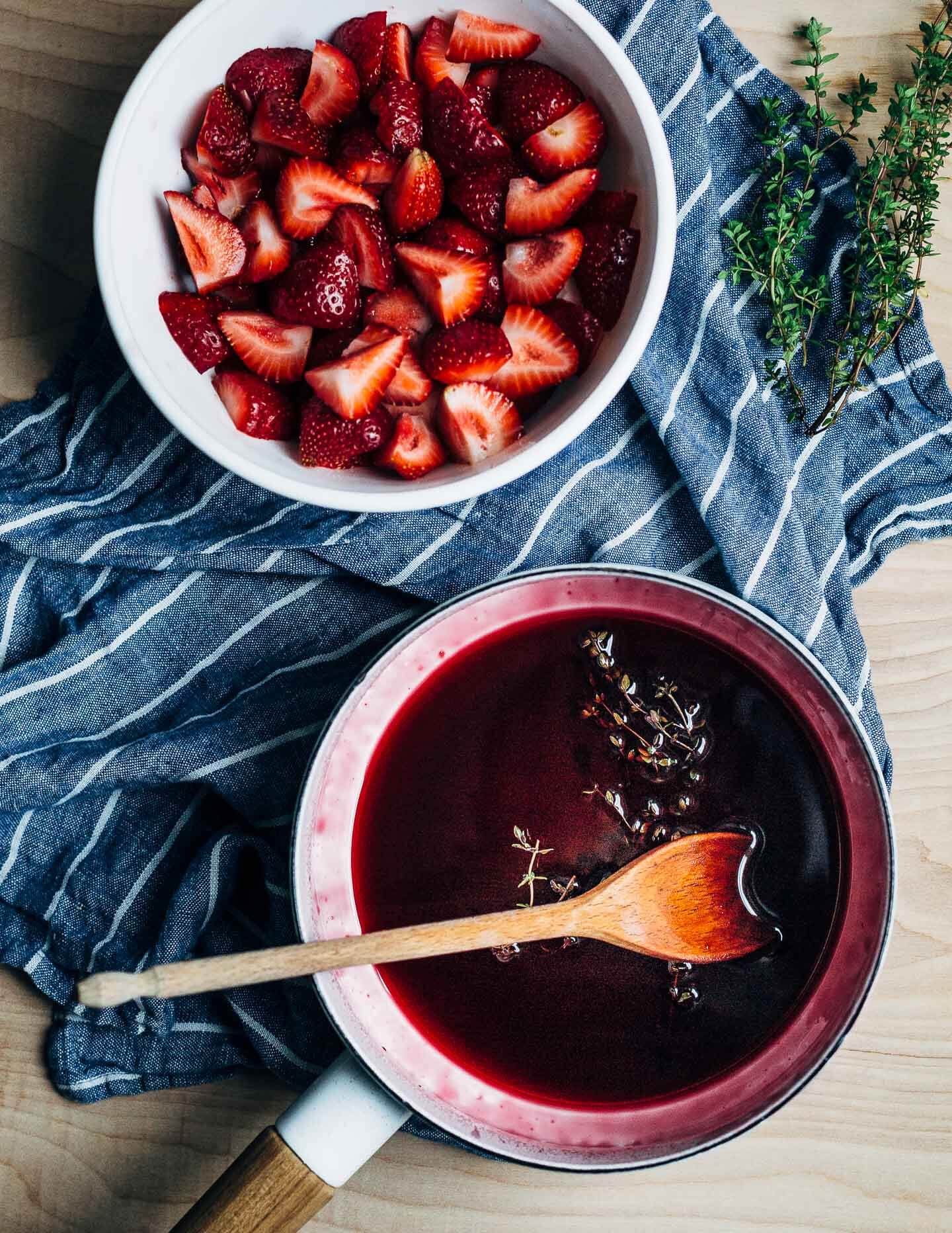 Ripe strawberries in red wine is the kind of effortless summer dessert that we all need more of. With hints of lemon and fresh thyme, the red wine reduction melds beautifully with ripe strawberries and is perfect spooned over vanilla ice cream. 