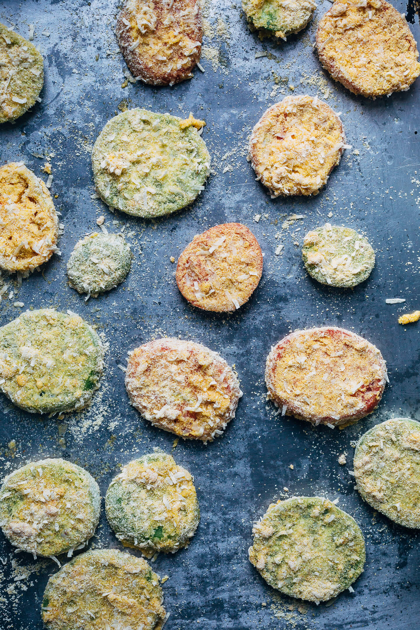 Putting leftover green tomatoes to good use with a recipe for crisp, savory fried green tomatoes topped with garlicky sautéed shrimp and a super simple remoulade.