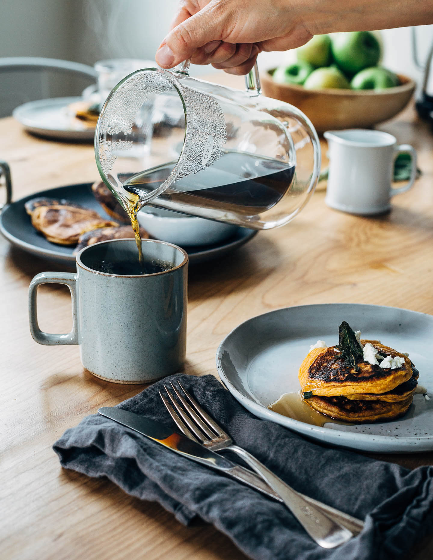 An autumnal sweet potato pancake recipe topped with fried sage leaves and crumbled goat cheese.
