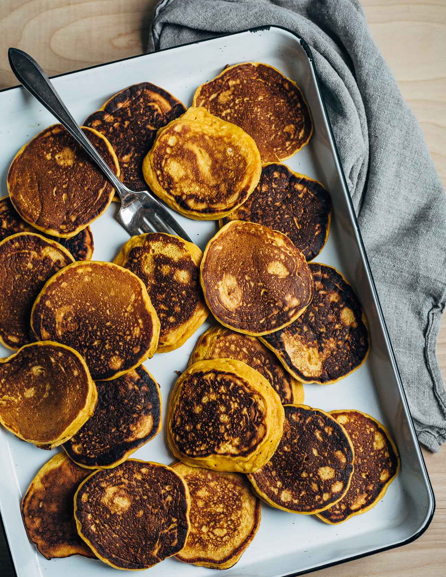 An autumnal sweet potato pancake recipe topped with fried sage leaves and crumbled goat cheese.