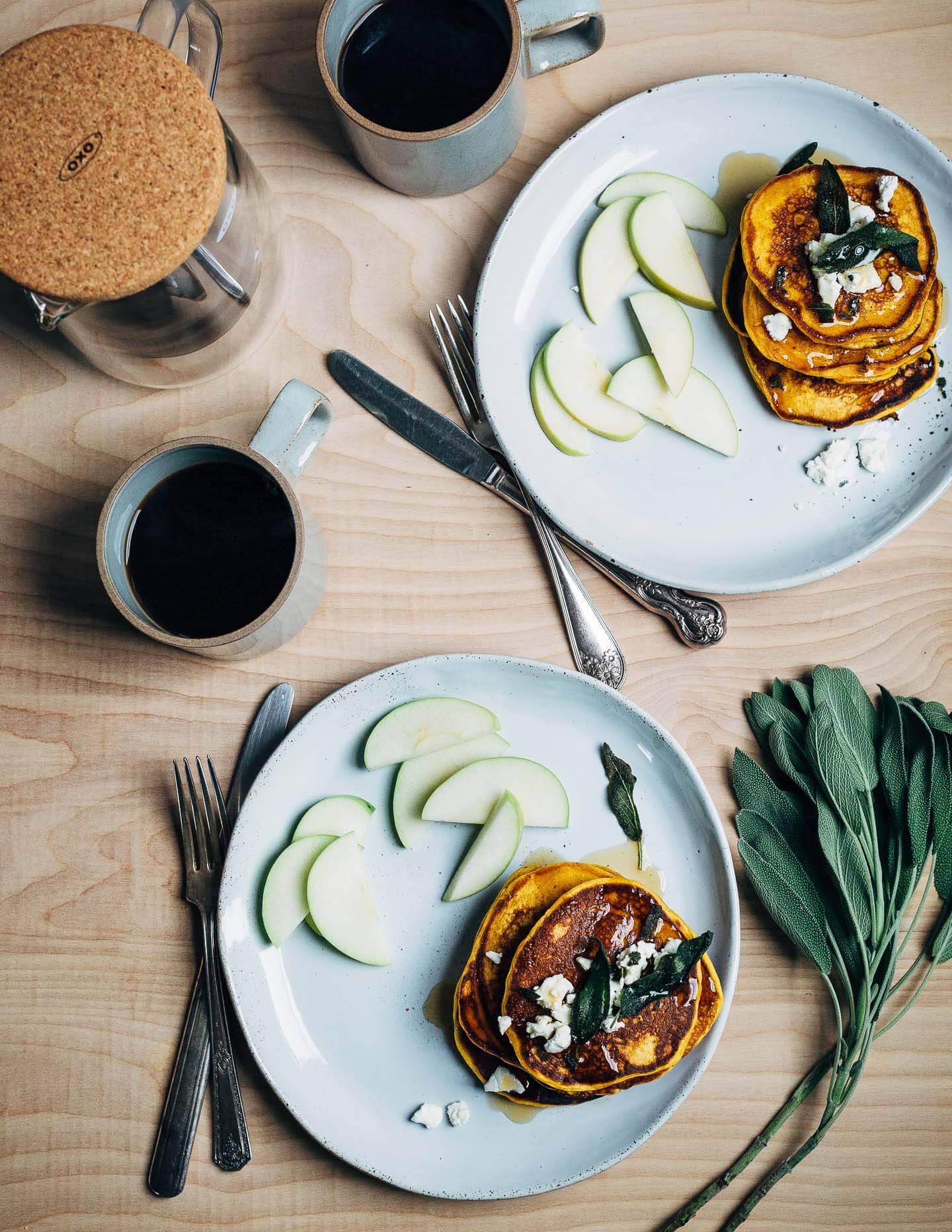 An autumnal sweet potato pancake recipe topped with fried sage leaves and crumbled goat cheese.