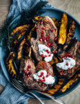Add a pop of char and smoke to your Thanksgiving feast with this recipe for cumin-rubbed grilled lamb chops, grilled acorn squash wedges, dill and fennel tzatziki, and pomegranate arils.