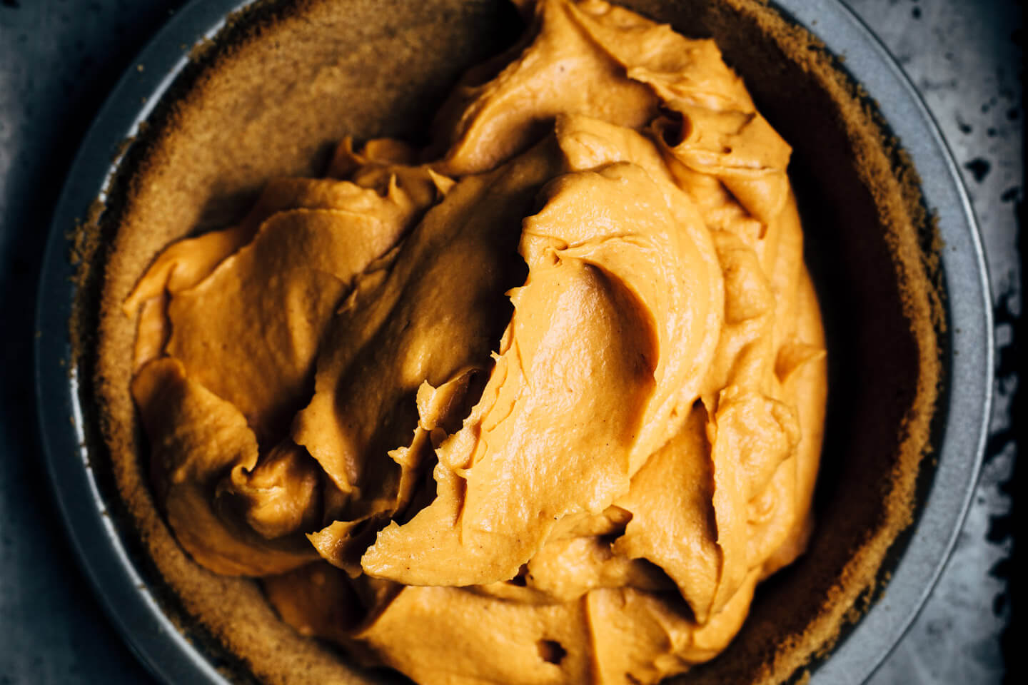End your Thanksgiving feast with this light and silky bourbon-spiked sweet potato pie baked in a classic graham cracker crust and topped with a big dollop of brown sugar whipped cream. 
