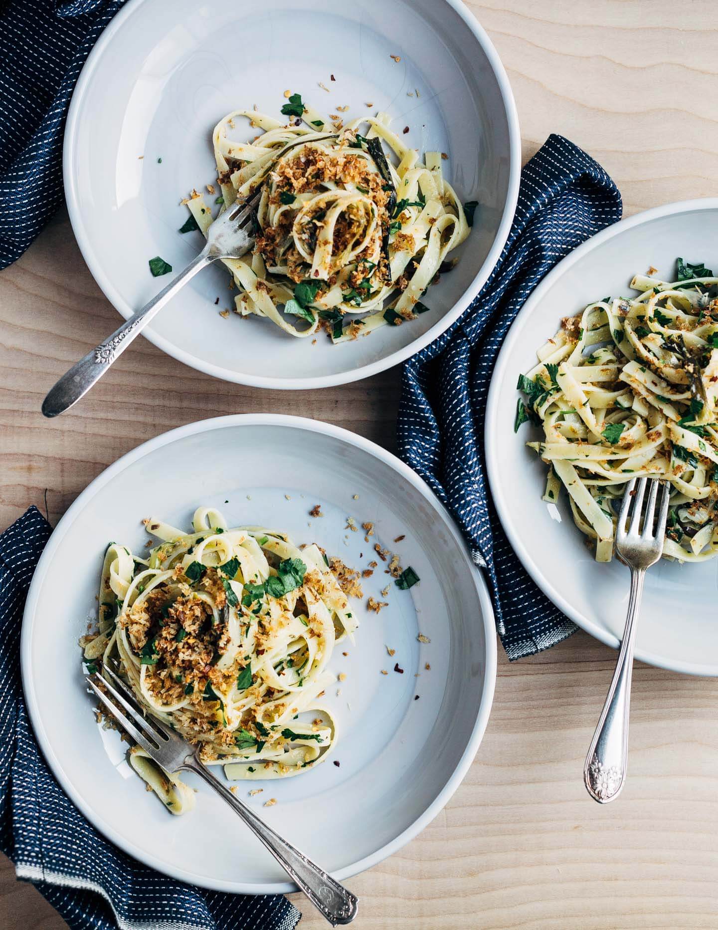 A hearty dish for early spring that's at once briny, rich, and herbaceous. Fettuccine noodles are tossed with delicate roasted spring onions, capers, herbs, tinned sardines, and buttery panko for a meal that's deeply satisfying. 