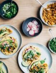 Chipotle chilies in adobo sauce lend smoky heat to these classic chicken tacos topped with avocado, radish, cilantro, and crumbled cotija.