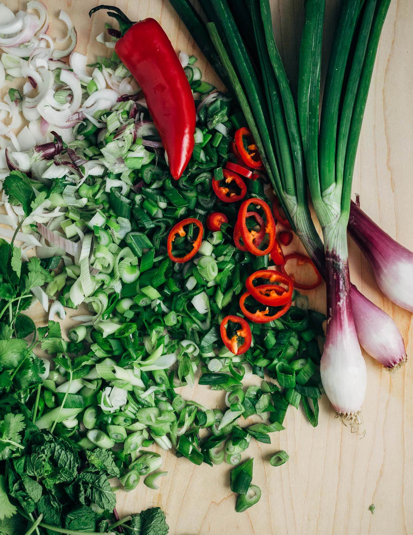 Fresh sliced mango and shrimp seared in coconut oil tossed with chilis, herbs, rice noodles, and a simple lime sauce makes for a nearly effortless, crazy flavorful weeknight meal.