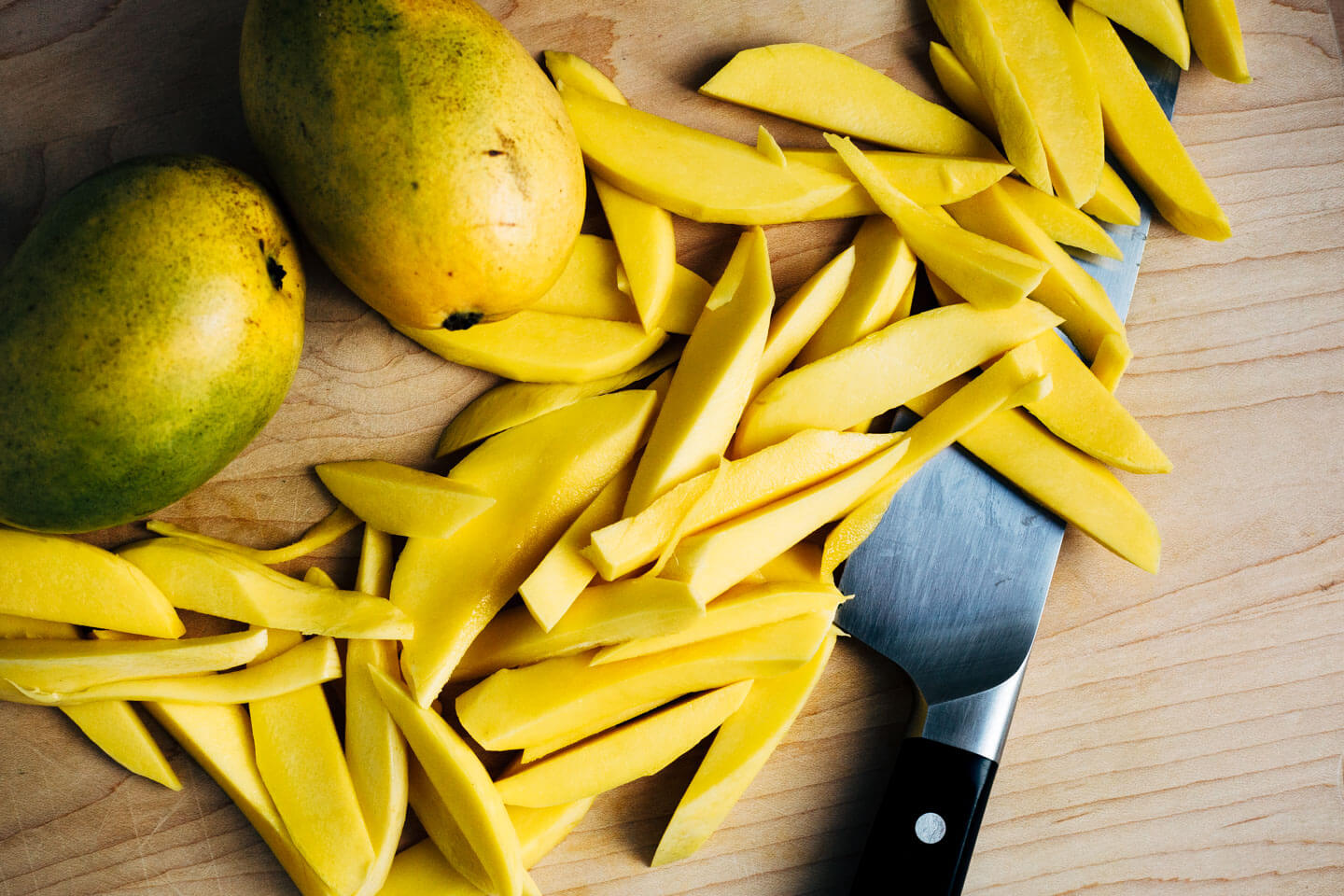 Fresh sliced mango and shrimp seared in coconut oil tossed with chilis, herbs, rice noodles, and a simple lime sauce makes for a nearly effortless, crazy flavorful weeknight meal.