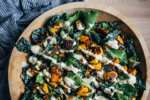 A richly flavored kale Caesar salad with roasted butternut squash and sunflower seed Caesar dressing.