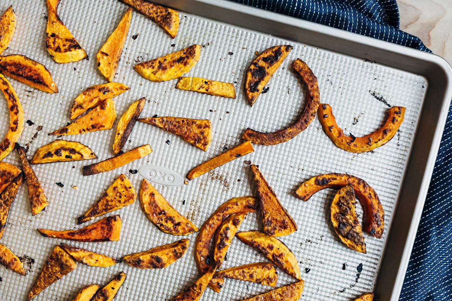 Roasted butternut squash on a sheet pan. 