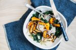A not sad desk lunch featuring a roasted butternut squash, kale, and quinoa salad.
