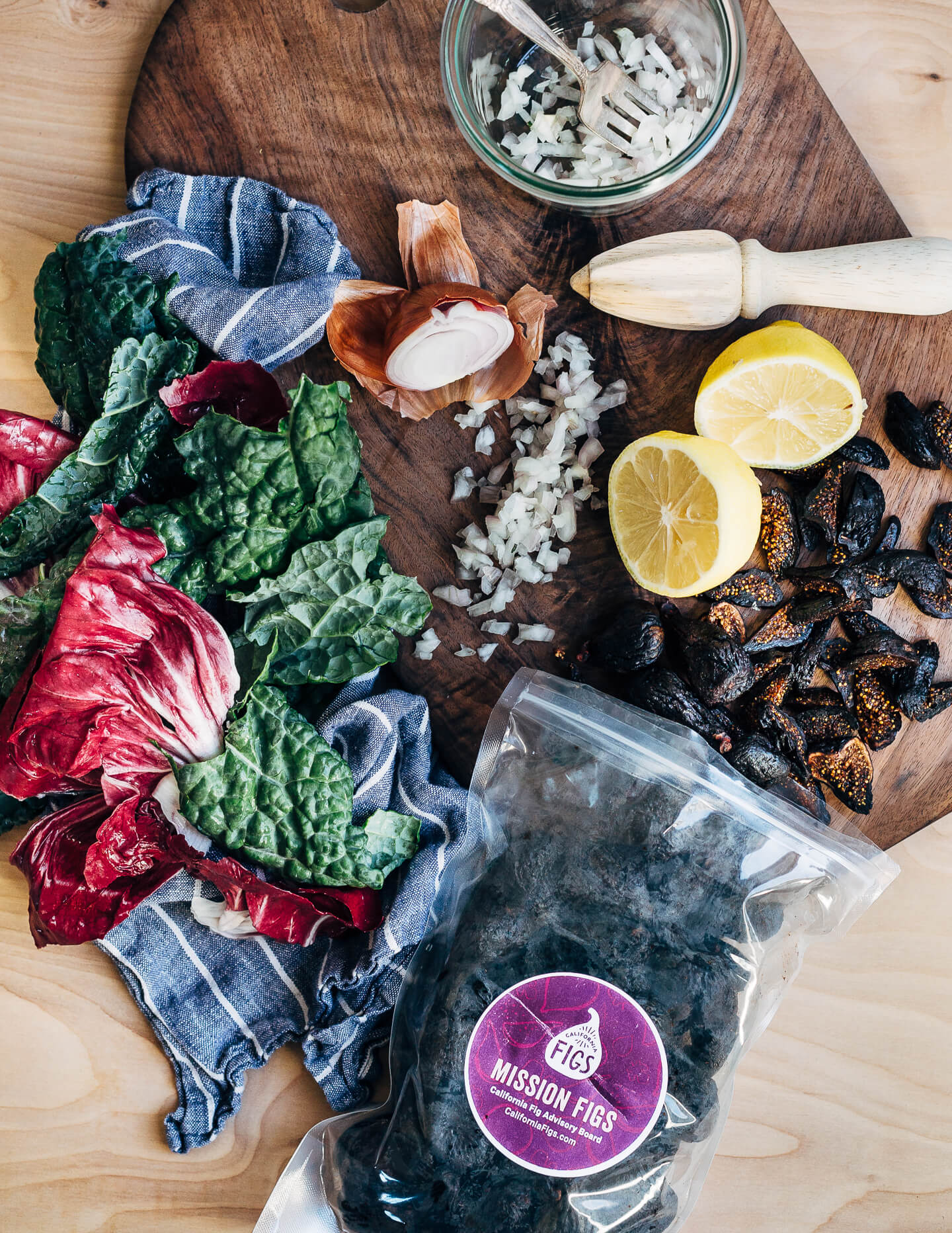 Ingredient prep for a dried fig and toasted farro salad with kale and radicchio. 