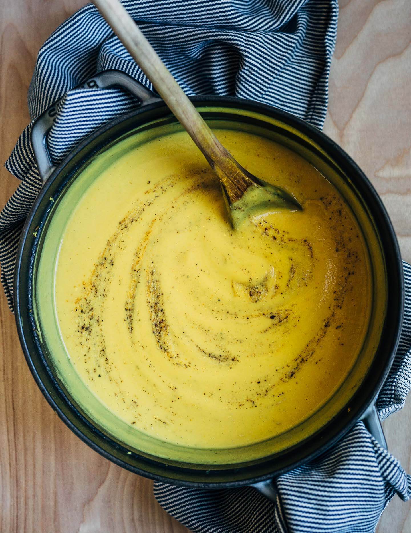 A simple cauliflower soup swirled with ground cayenne and black pepper. 
