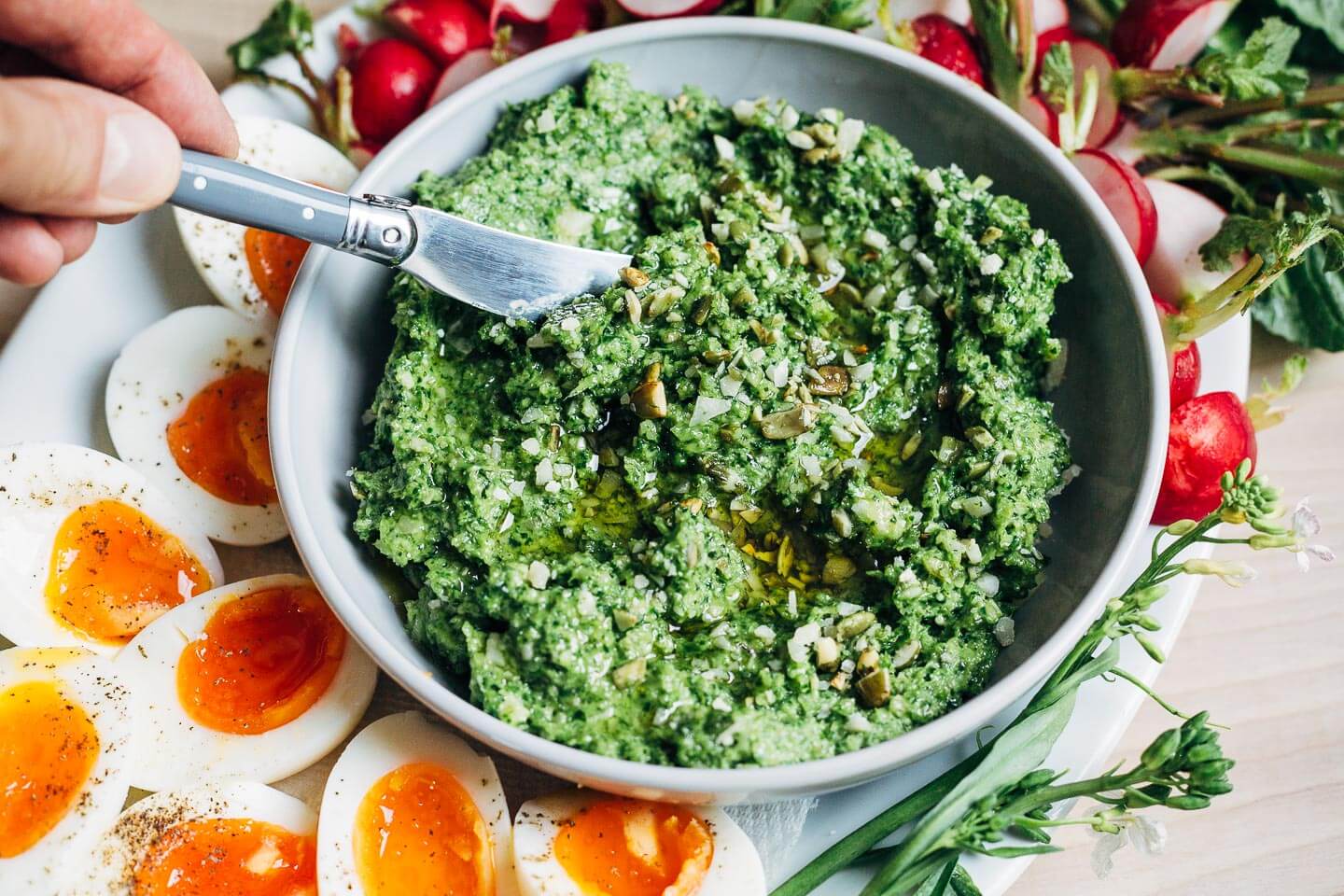 Green garlic pesto with steamed eggs and radishes.
