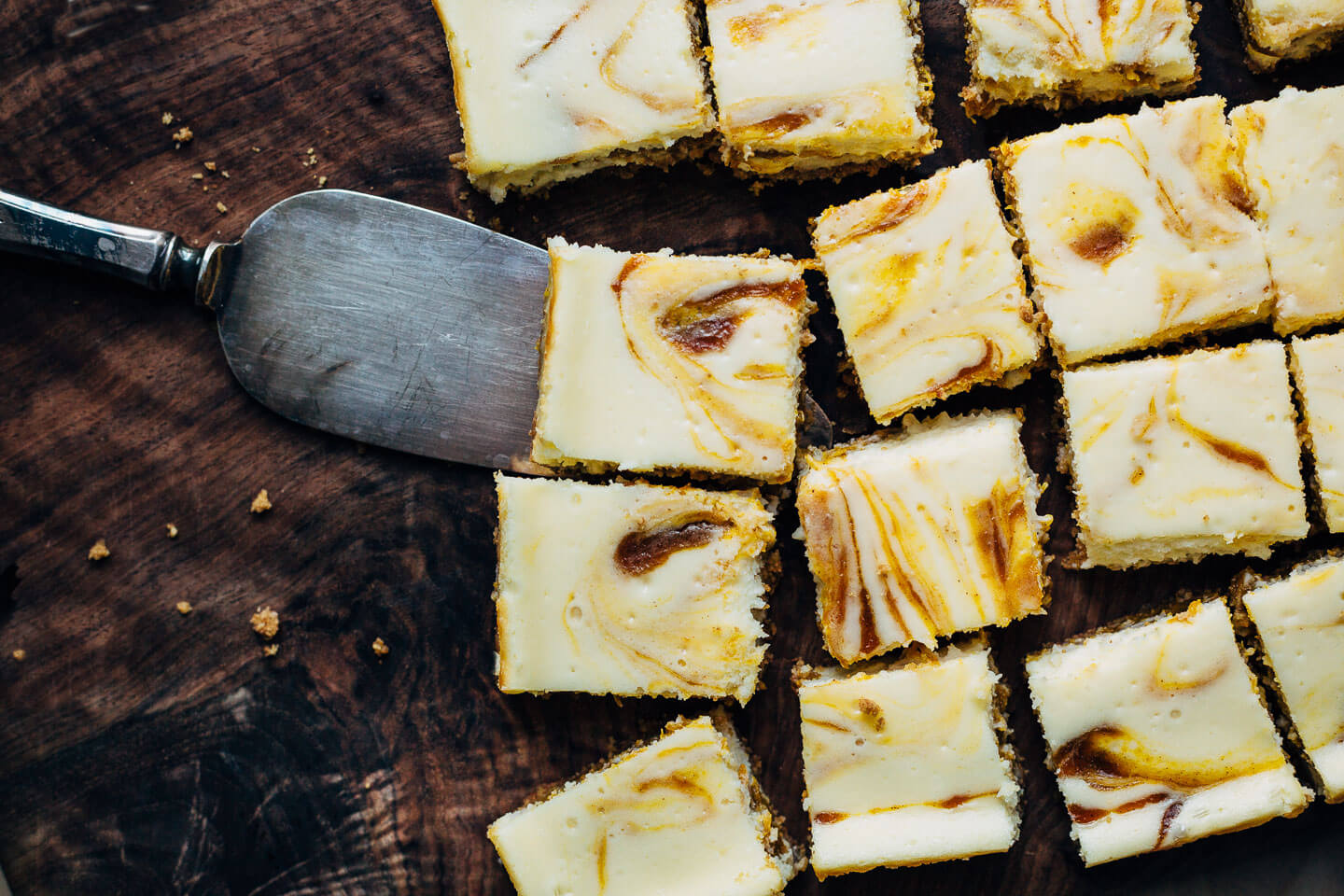 From Sarah Kieffer's new cookbook, 100 Cookies, these airy cream cheese pumpkin pie bars with a buttery graham cracker crust and spiced pumpkin pie swirls are the perfect fall treat!