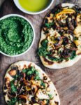 These roasted cauliflower and mushroom flatbreads feature crispy roasted vegetables and creamy arugula pesto atop skillet toasted naan.