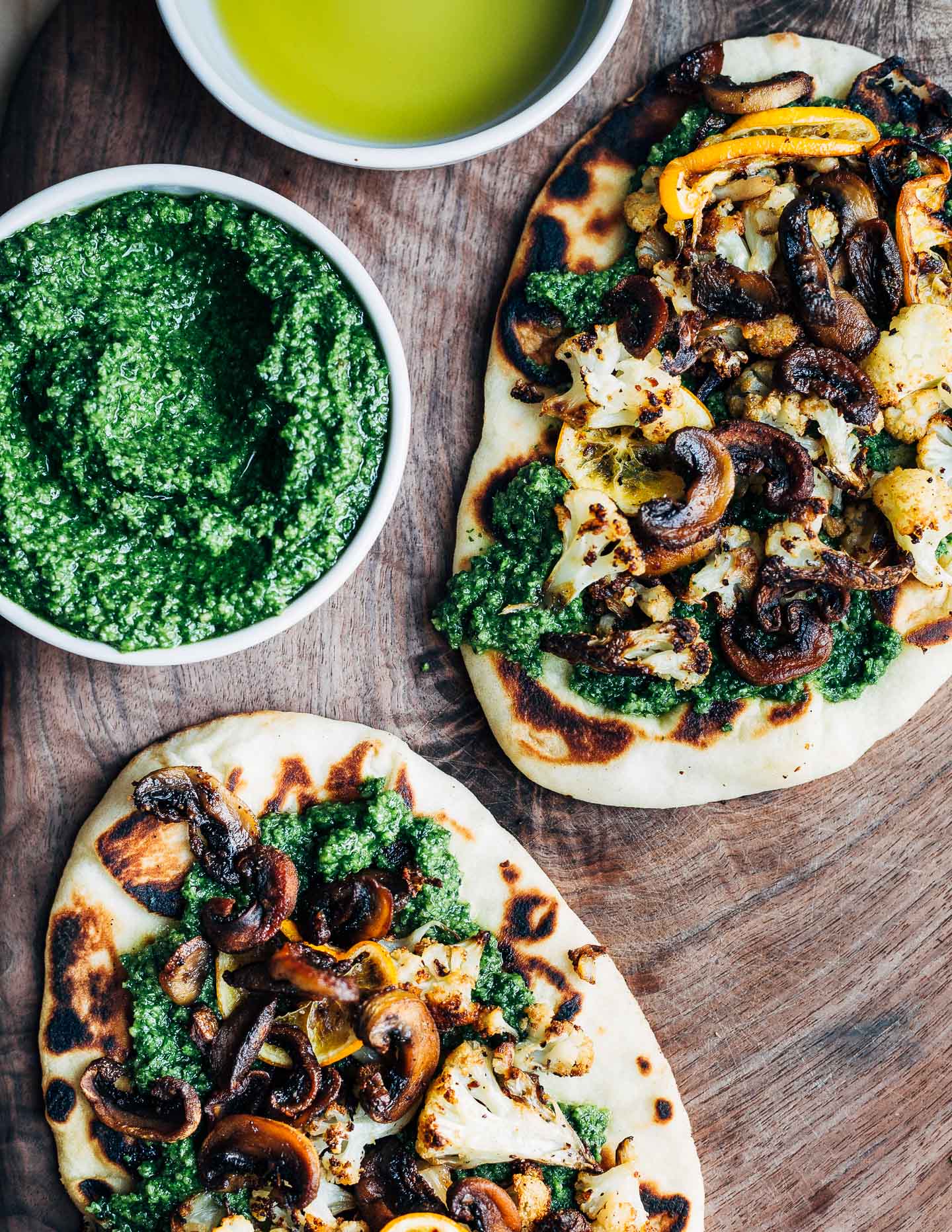 These roasted cauliflower and mushroom flatbreads feature crispy roasted vegetables and creamy arugula pesto atop skillet toasted naan. 