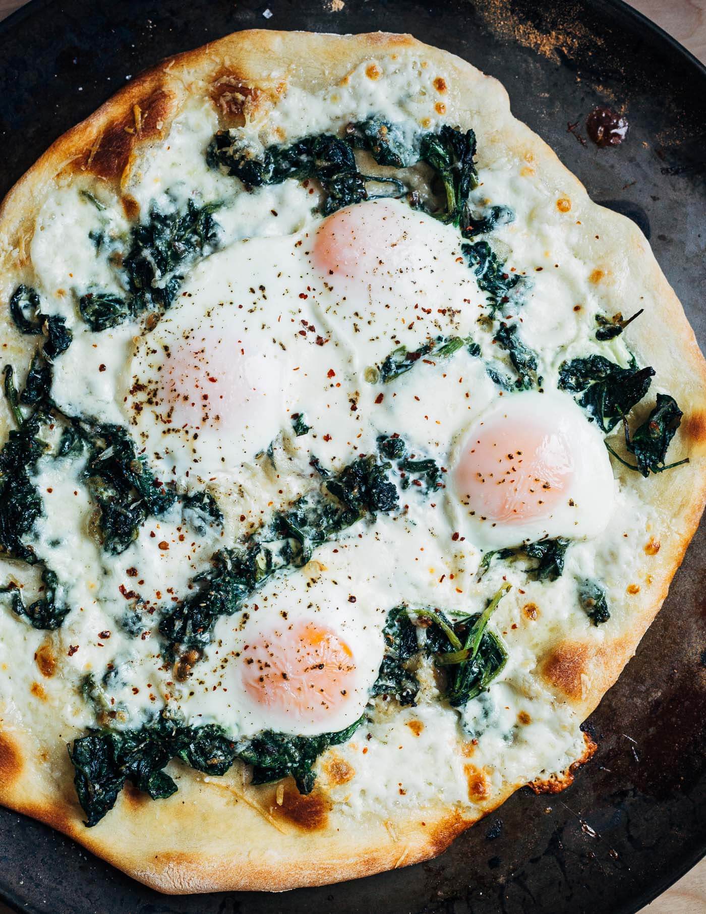 Egg and greens pizza, just out of the oven.
