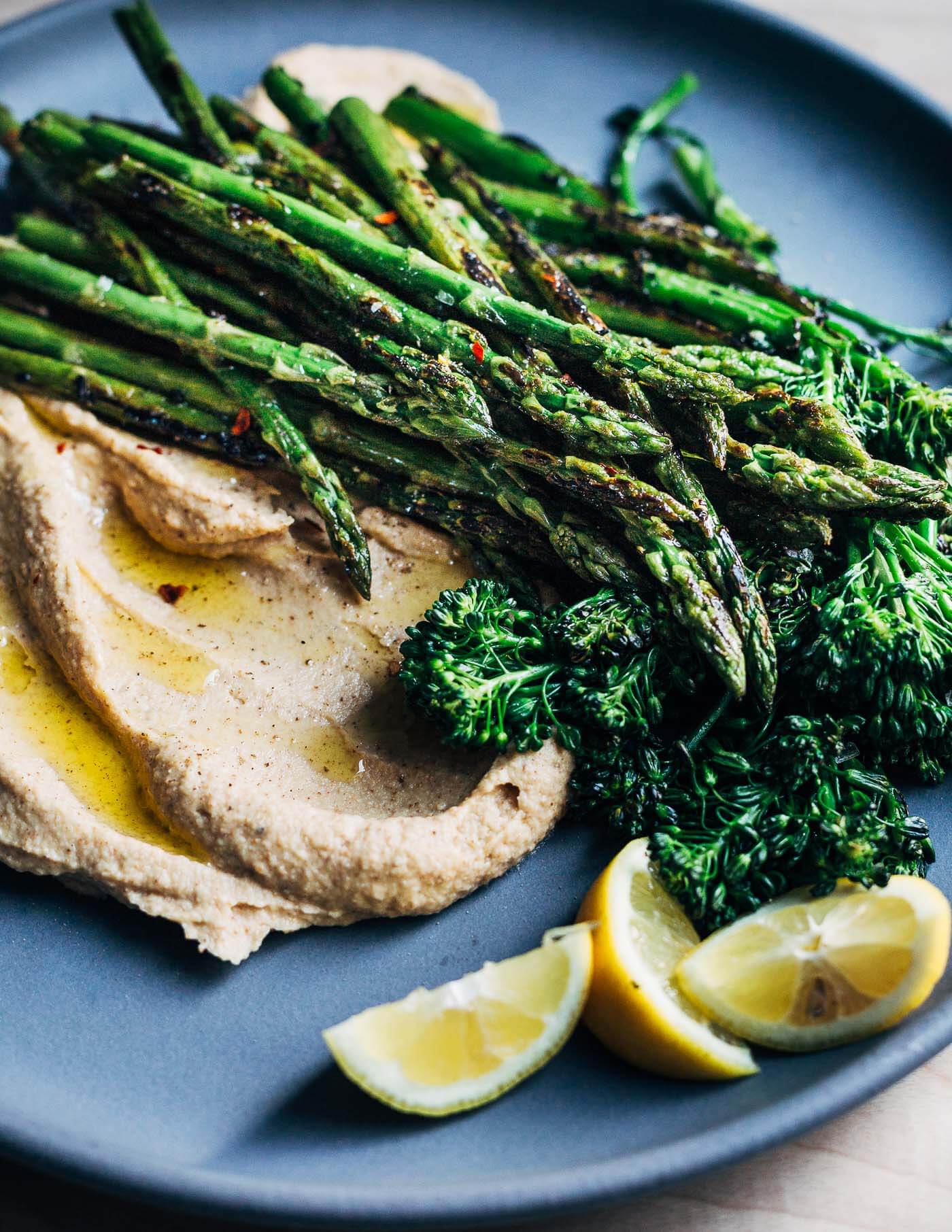 A big plate of vegetables with incredible depth of flavor, this roasted garlic and cauliflower puree topped with sautéed asparagus and broccolini perfectly captures the shifting spring season.