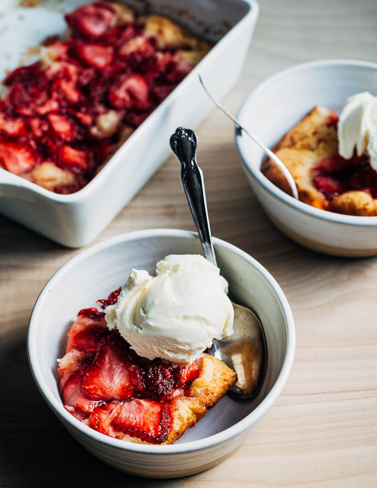 This easy-to-bake strawberry spoon cake lies somewhere between a cake and a cobbler. It bakes up beautifully and harnesses all the juices of ripe summer berries. This recipe is a variation on a classic summer fruit dessert known as "Essie's cobbler."