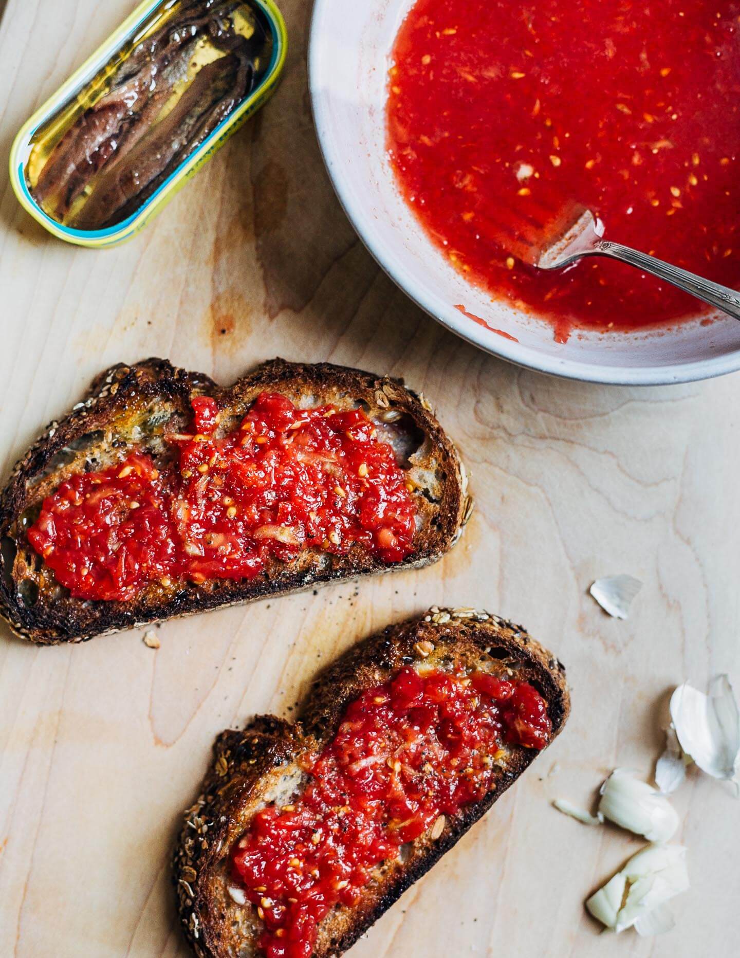 Assembling the pan con tomate.