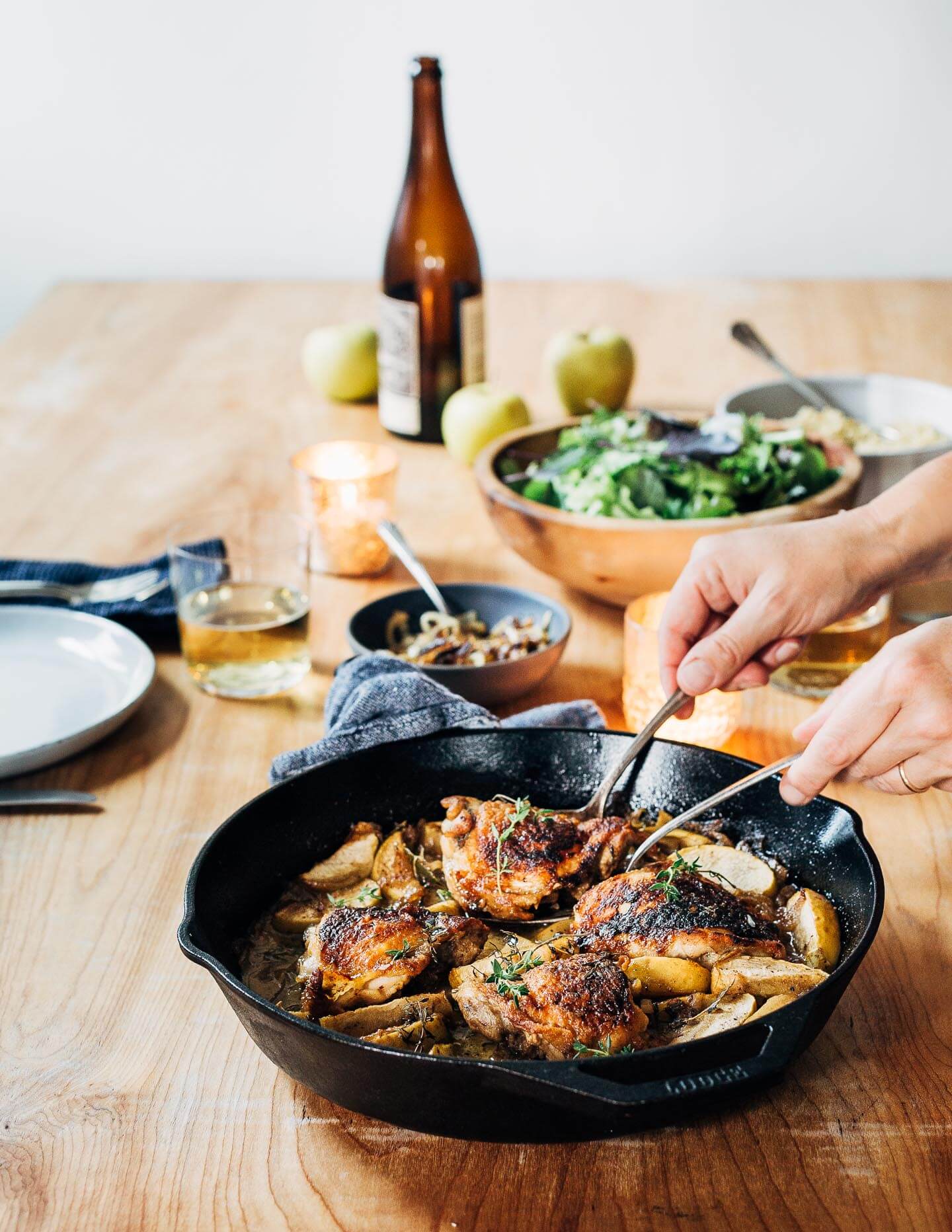Serving cider-braised chicken and apples with freekeh and a green salad.