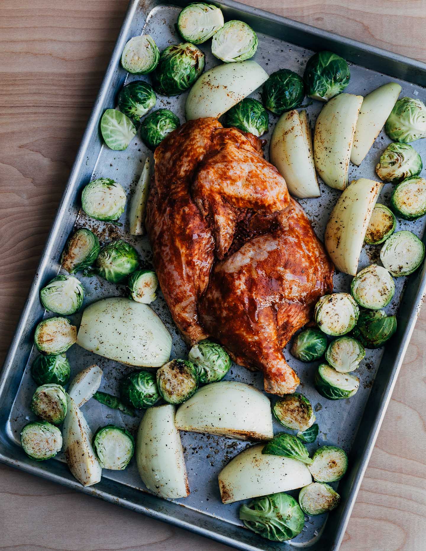 Sheet pan roasted half chicken and with Brussels sprouts and onions.
