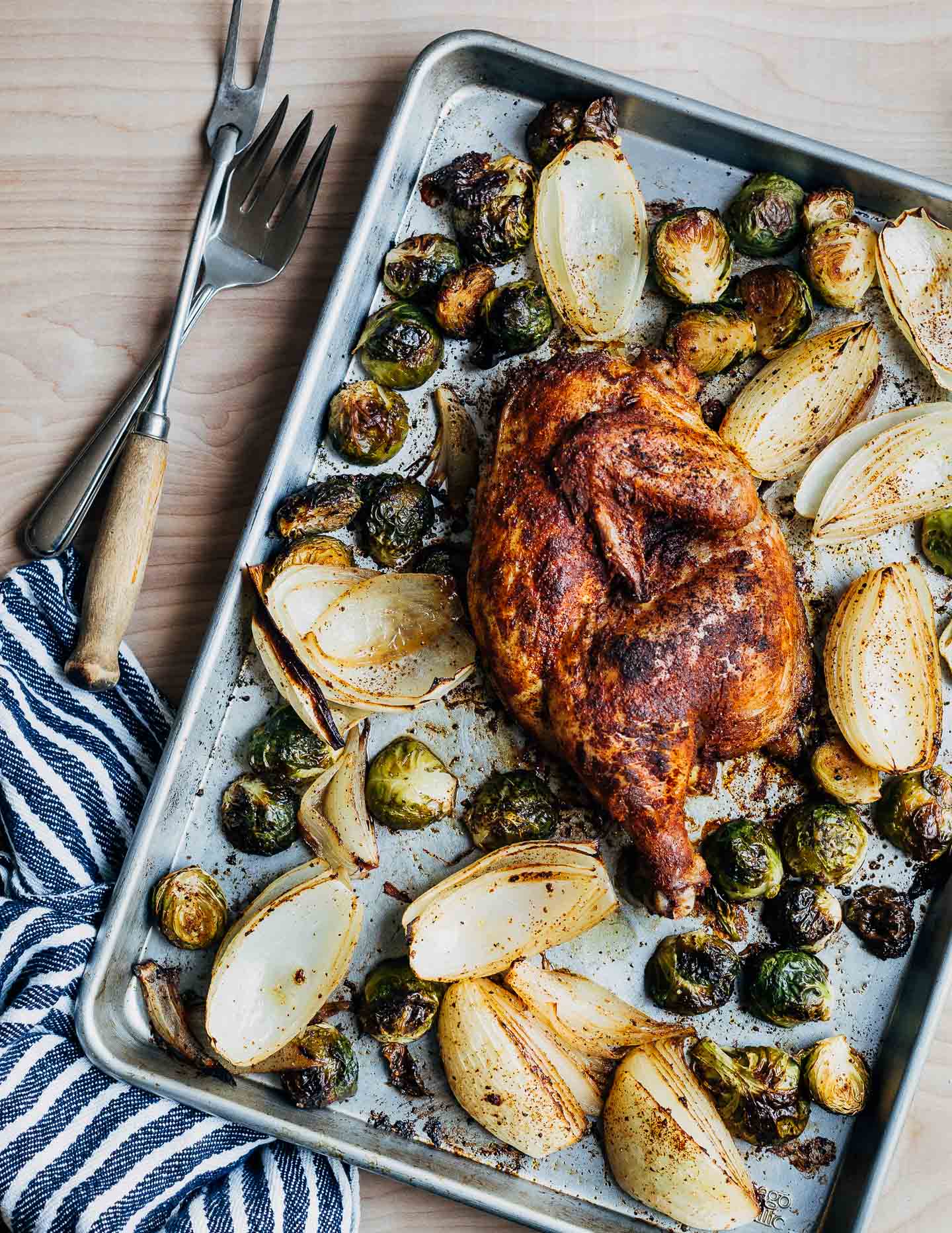 A Thanksgiving feast for two, featuring recipes for sheet pan half chicken with roasted Brussels sprouts and onions, and a simple gravy made with the pan drippings. Serve with mashed potatoes and mac and cheese, and you have the perfect Thanksgiving for two (with plenty of leftovers!).