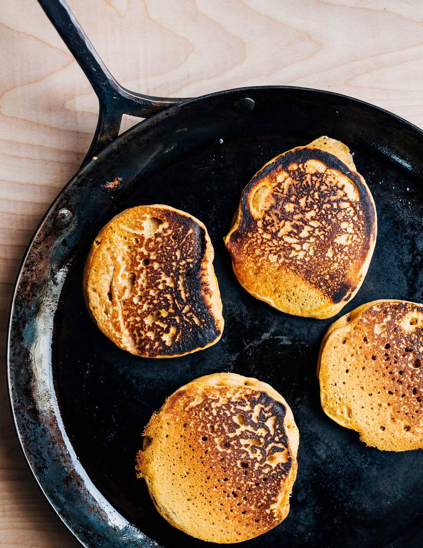 Vegan pumpkin pancakes in the skillet.