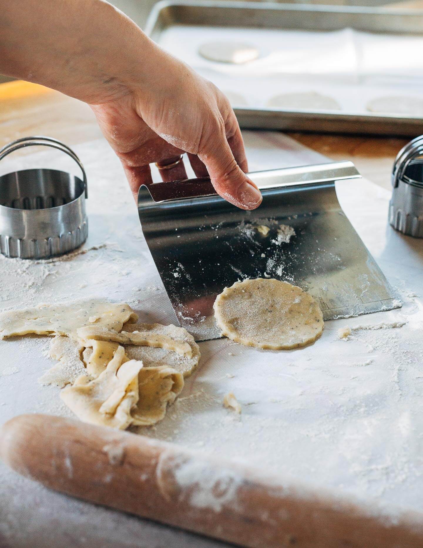 Rolling out poppy seed cookies.