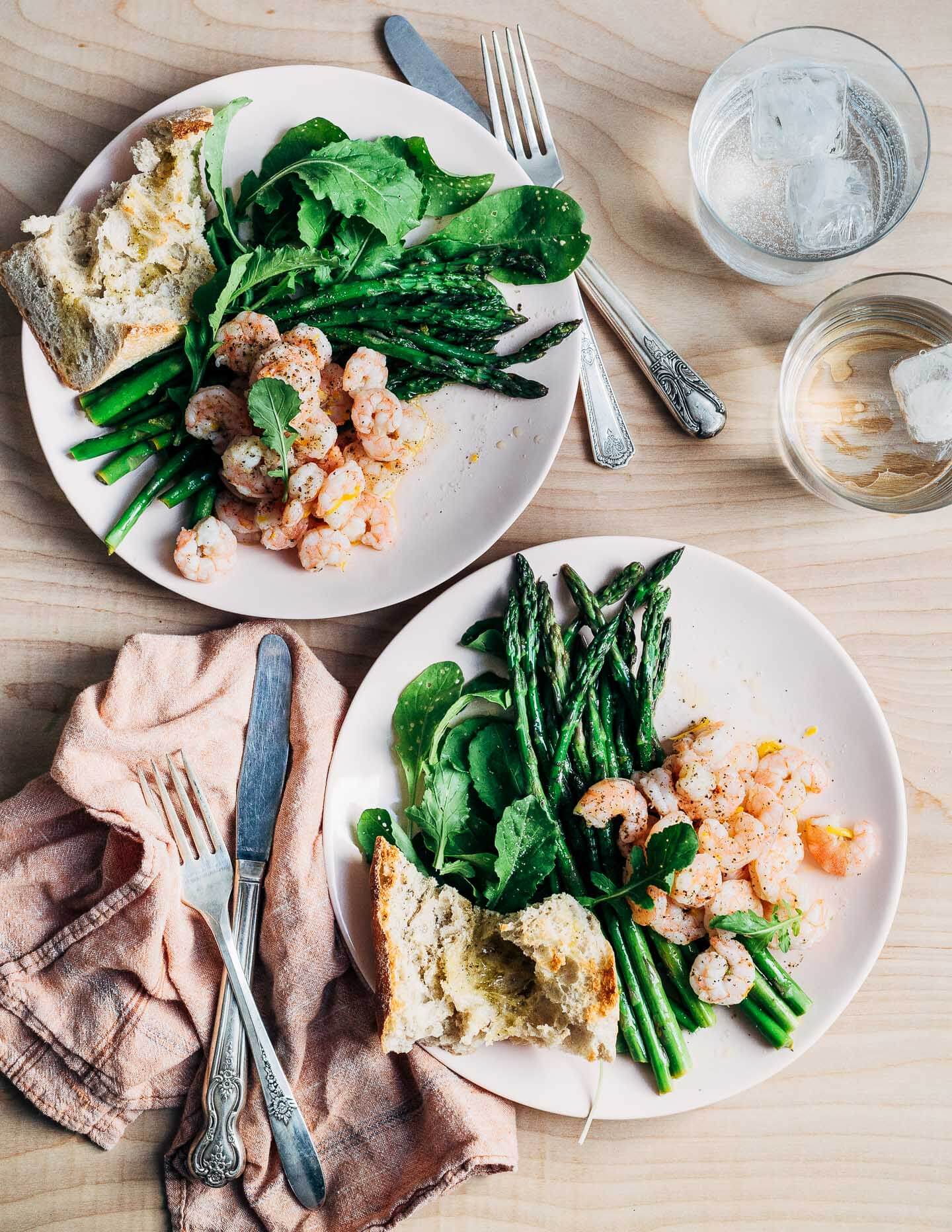 Celebrate the arrival of spring produce with this simple, super quick warm asparagus and shrimp salad topped with Meyer lemon and olive oil dressing. Add a few hunks of crusty bread and a bottle of rosé, and you have a spring feast fit for company or a languid evening outside.