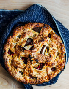 Looking down on a lattice top pie with a decorative leaf crust