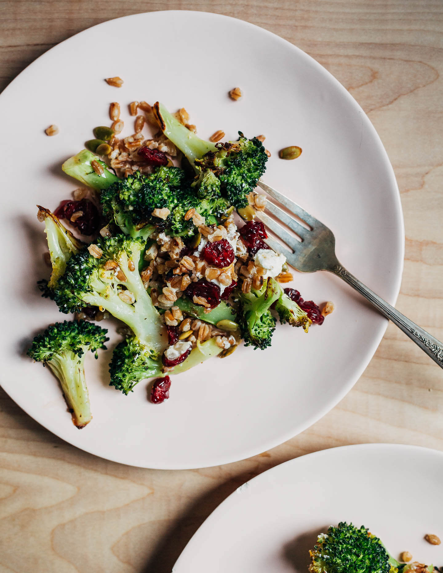 A plate with broccoli salad.