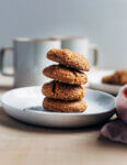 A stack of cookies on a plate.